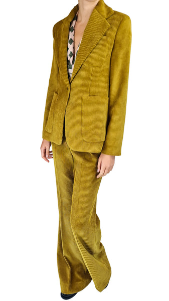 A model wearing a matching olive yellow corduroy blazer and wide-leg trousers set, styled with a patterned top underneath, against a plain white background.
mustard corduroy blazer • women's single-breasted corduroy jacket • retro tailored corduroy blazer • wide-wale patch pocket blazer