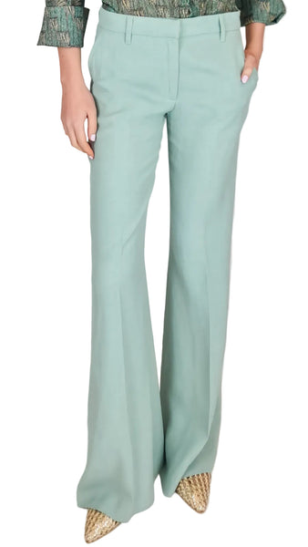 Light blue bell-bottom pants worn by a person on a plain background
